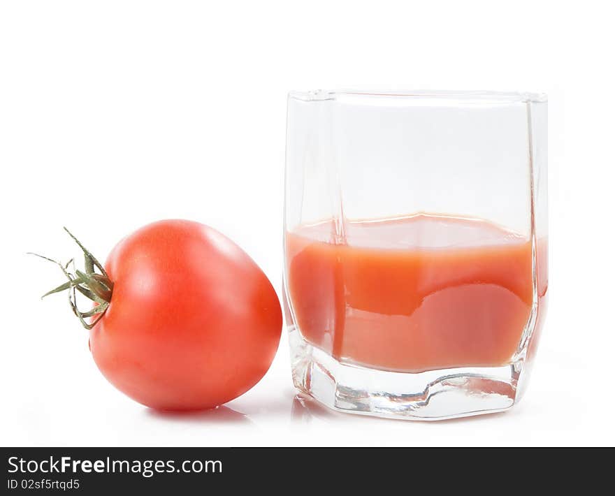 Tomato juice in glass over white