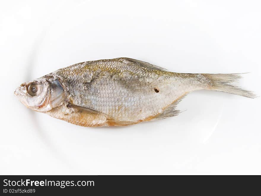 Dried whole sea roach on plate