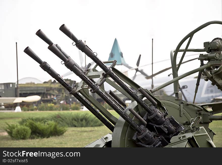 Trunks of anti-aircraft machine guns aimed at the sky. Small defensive weaponry.