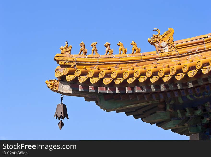 At a corner of the Summer Palace, a delicately decorated eaves with gilded roof, beautiful frieze, and dragon patterns. At a corner of the Summer Palace, a delicately decorated eaves with gilded roof, beautiful frieze, and dragon patterns.