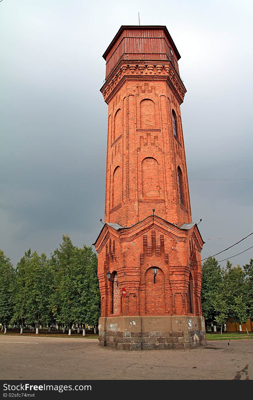 Aging water tower on dark background