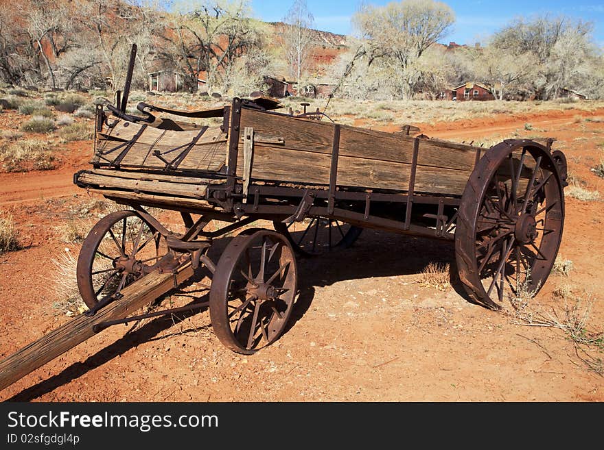 Old Farm equiptment in the desertwith blue sky and clouds in the background. Old Farm equiptment in the desertwith blue sky and clouds in the background