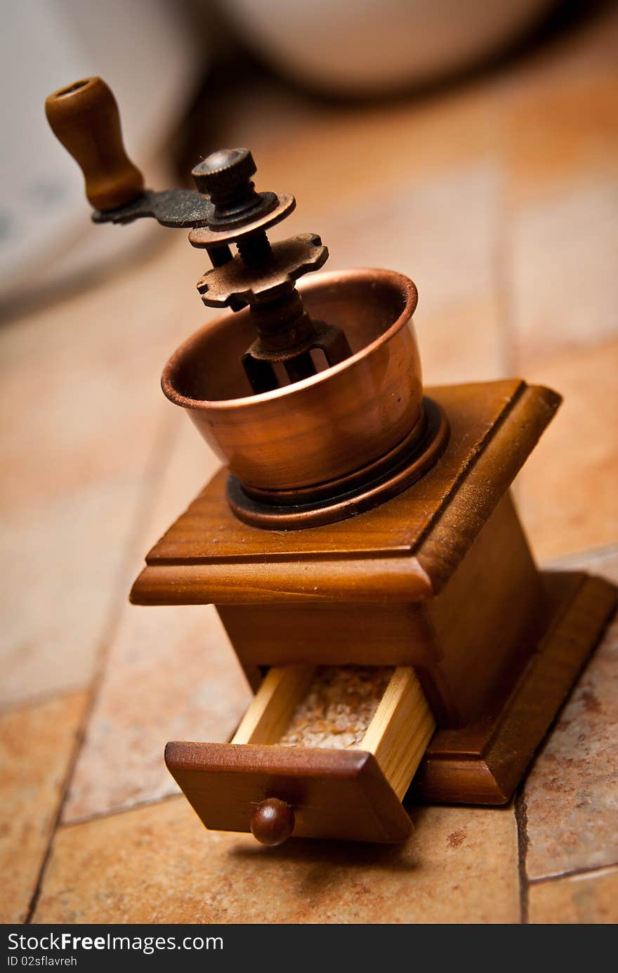 Grinder which is on the kitchen table. Grinder which is on the kitchen table