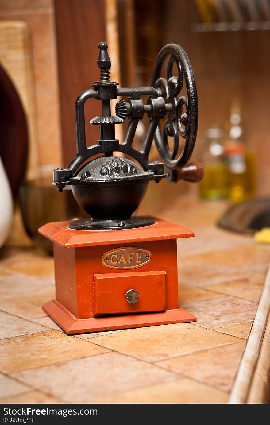 Grinder which is on the kitchen table. Grinder which is on the kitchen table