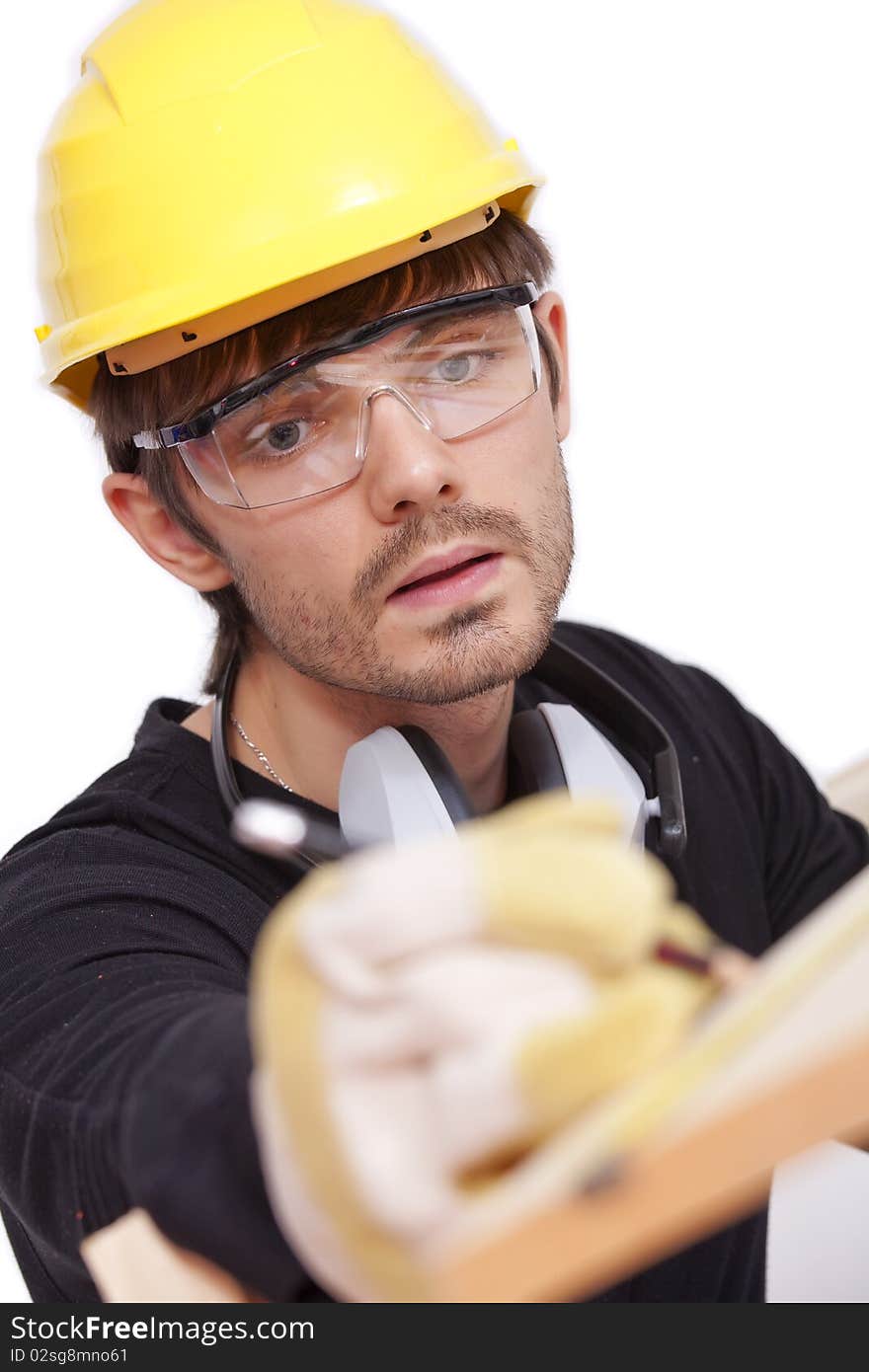 Construction worker making notice on wood - isolated on white