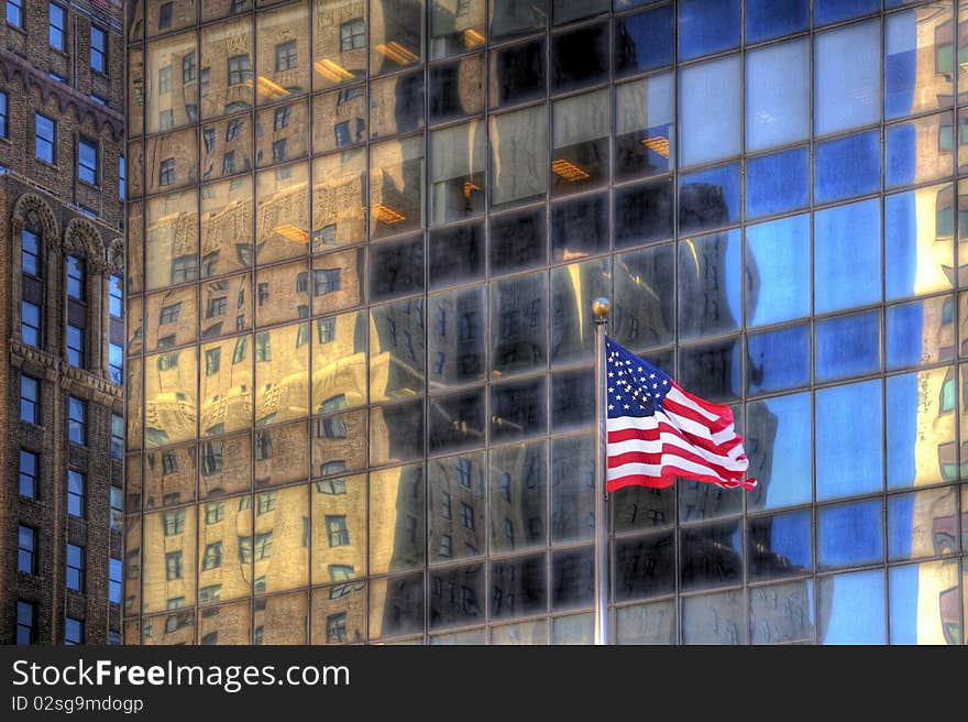 America flag against glassy buildings. America flag against glassy buildings.