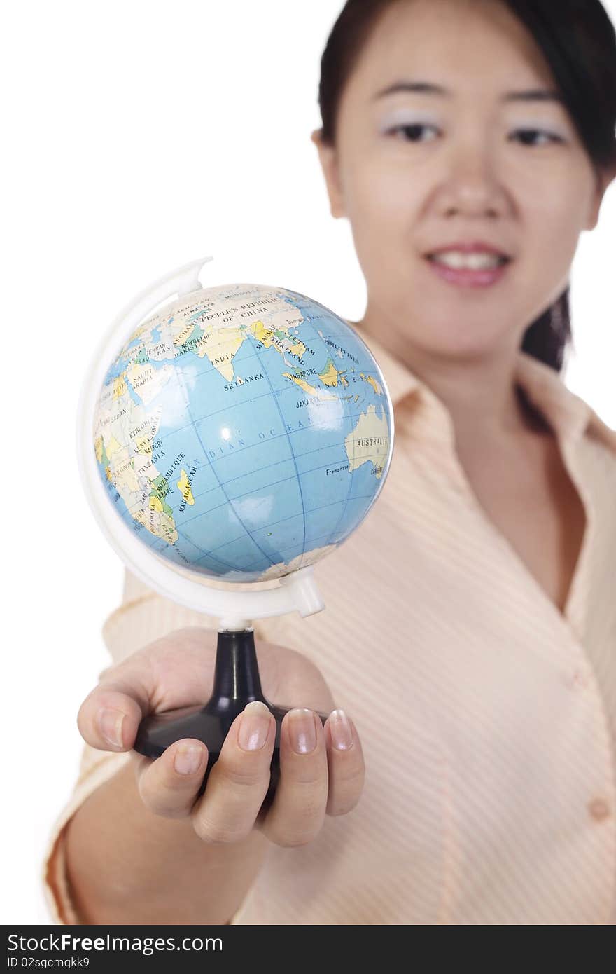 An Asian woman holding a mini globe. An Asian woman holding a mini globe