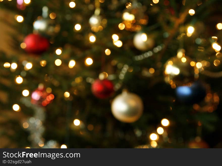 Blurred background from christmas tree with baubles and the lights. Blurred background from christmas tree with baubles and the lights