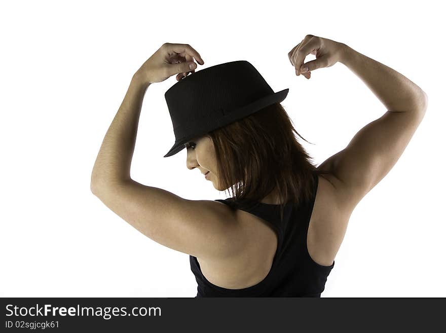 Well built sexy young Caucasian adult woman dancer with red hair posing with a black hat