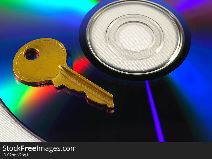 Key on a CD isolated on white concepts of data security