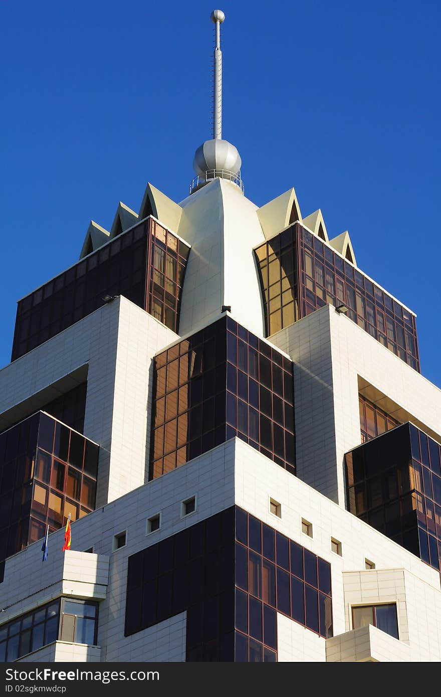 Part of a modern building against the blue sky. Part of a modern building against the blue sky