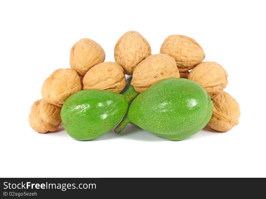 Ripe and unripe walnuts isolated on white