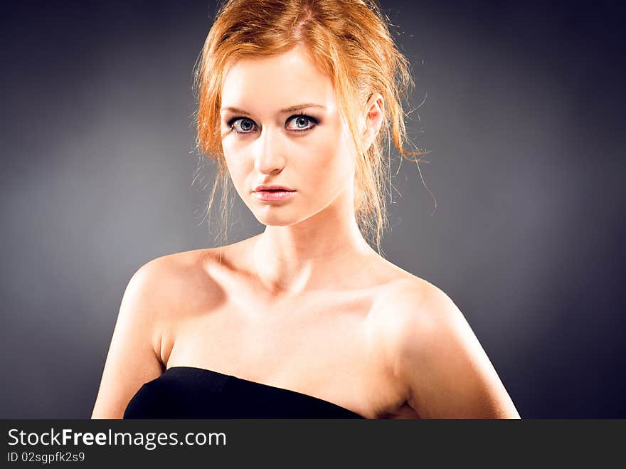 Portrait of a young red-haired woman. Portrait of a young red-haired woman