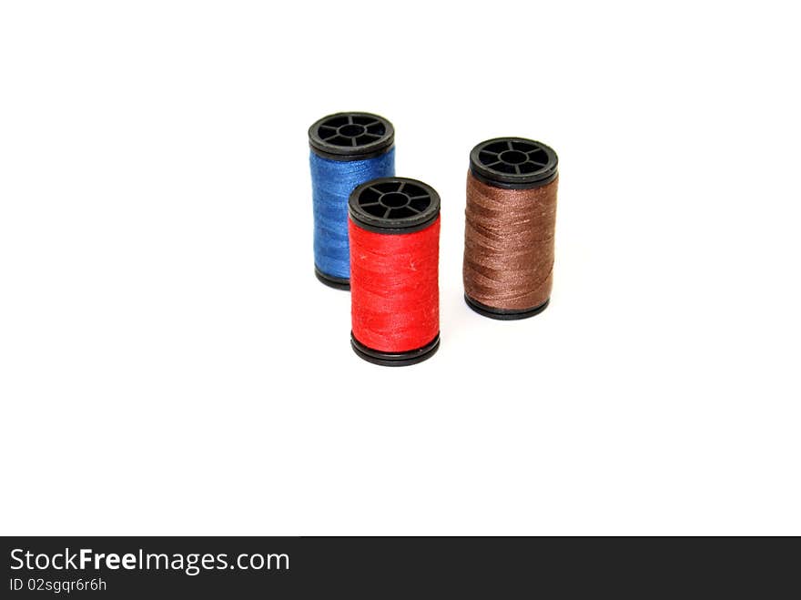 Serveral spools of colored thread