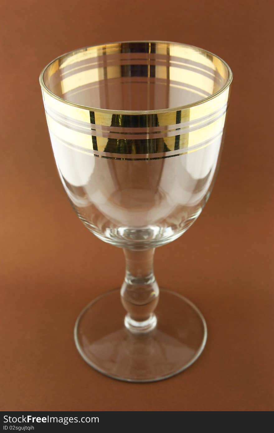 Retro goblet on the brown background