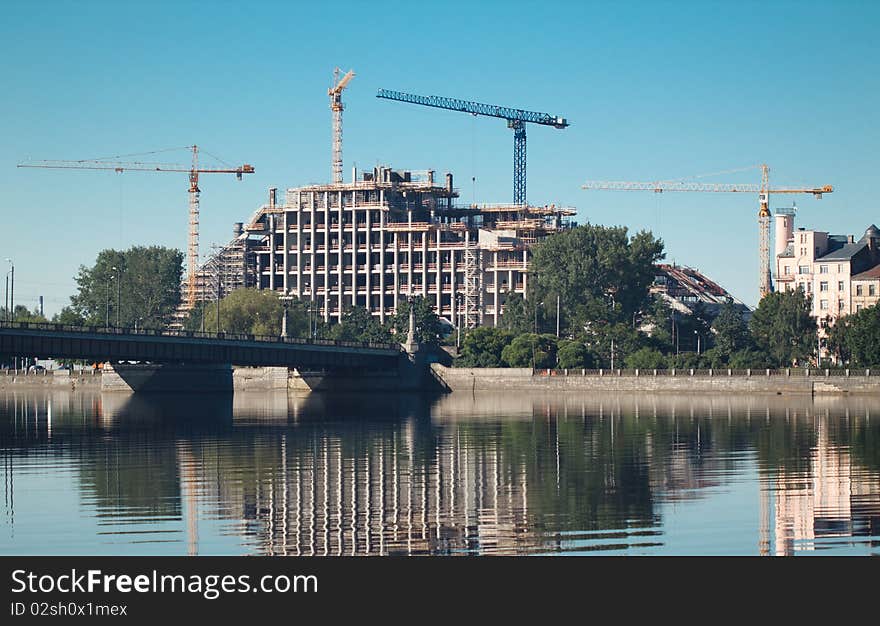 Jib crane construct building near the river