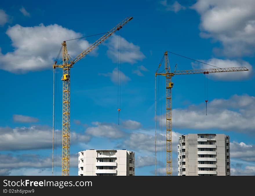 Building of the new high house by the crane. Building of the new high house by the crane