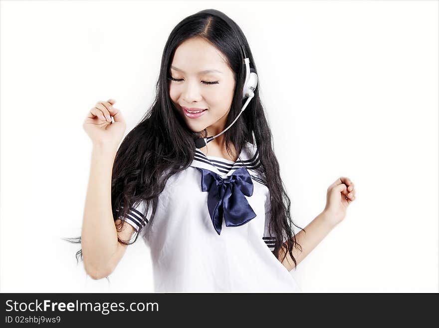 Asian schoolgirl enjoying music