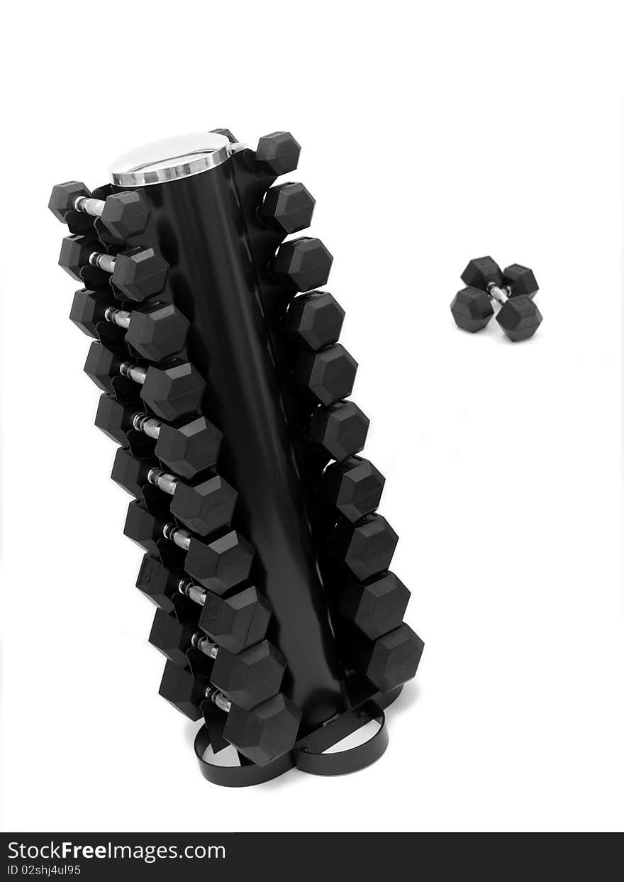 A dumbell rack with dumbells isolated against a white background