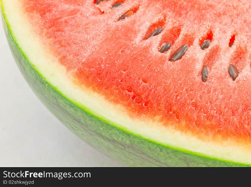 Half of Ripe Sliced Green Watermelon .