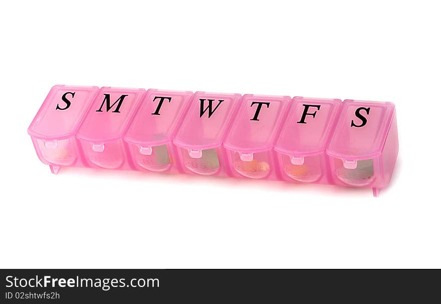 Pink pill box on white background