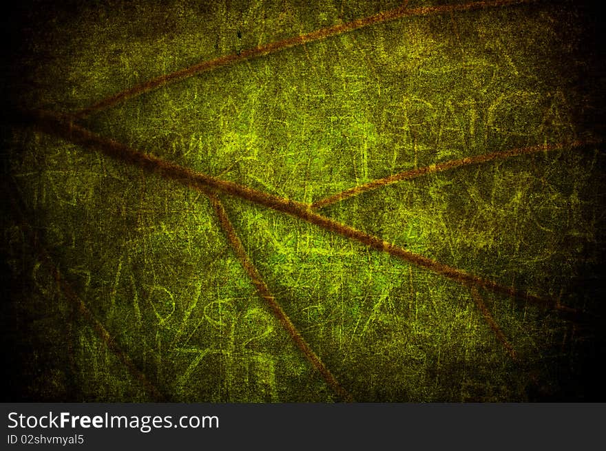 A texture with a green grunge leaf