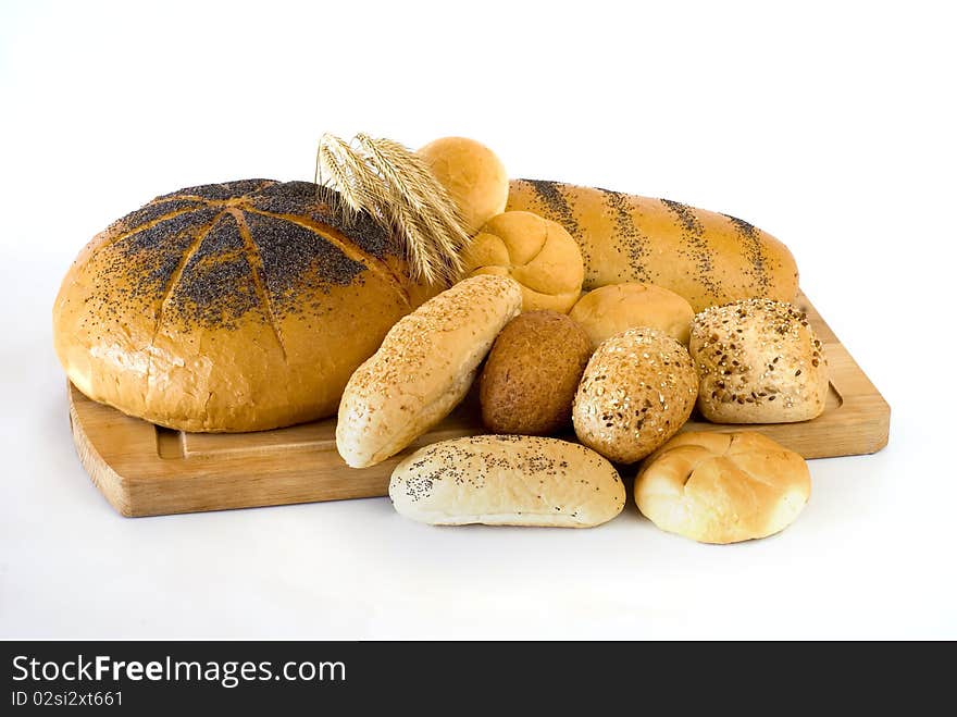 Fresh bread on the board on the white background