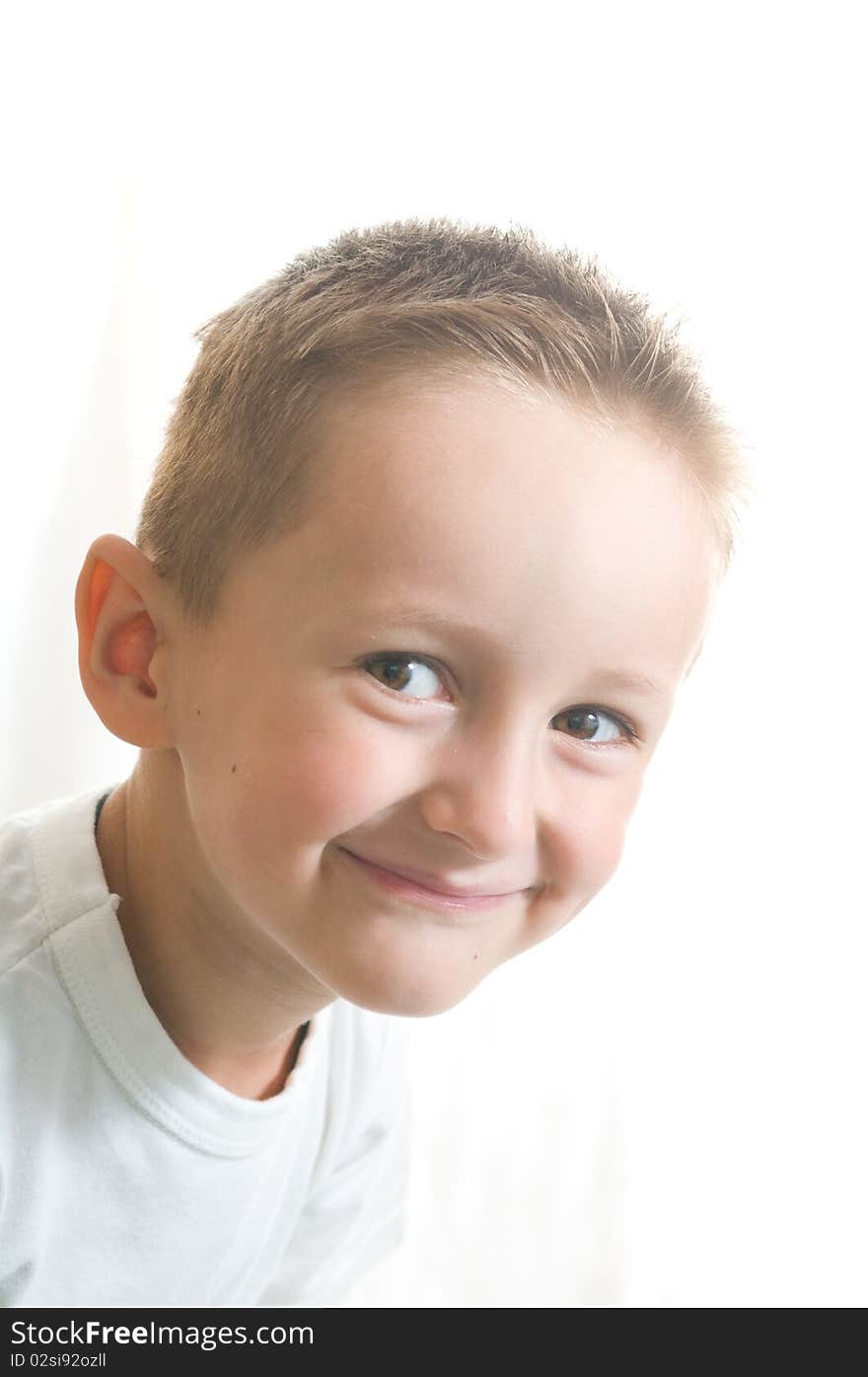 Little cute boy over white background