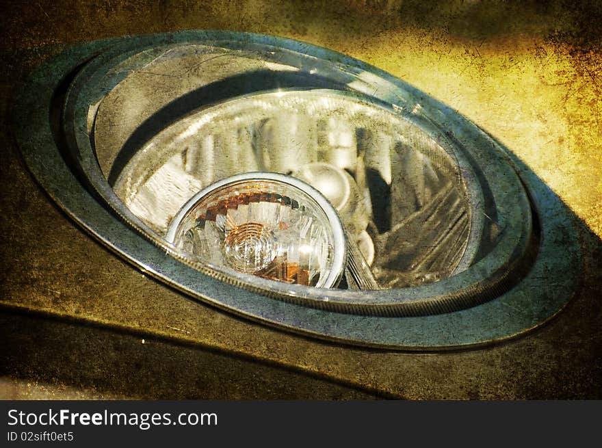 A grunge close up of an headlight. A grunge close up of an headlight