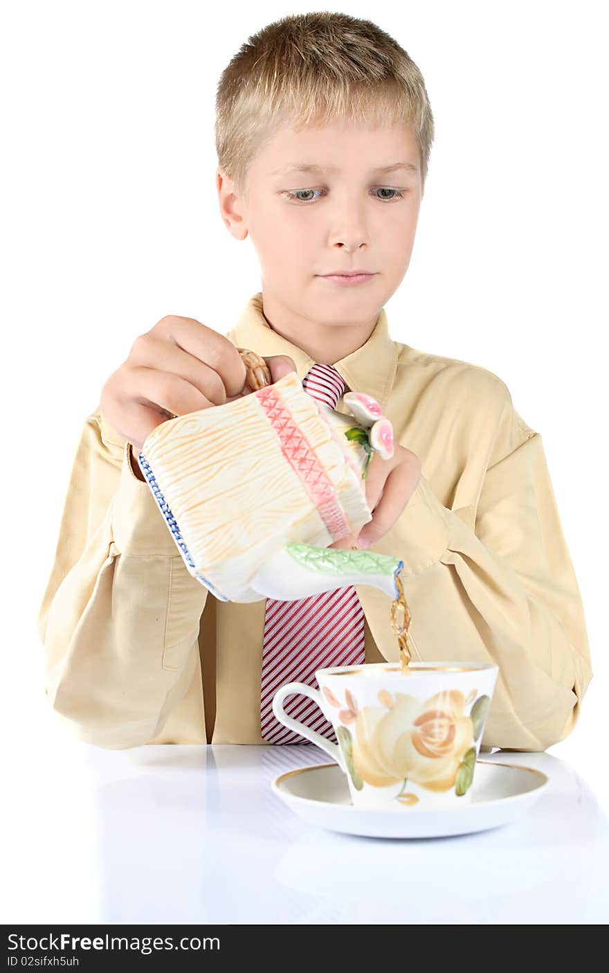 Portrait of young teenager drinking tea. Is isolated on a white background.