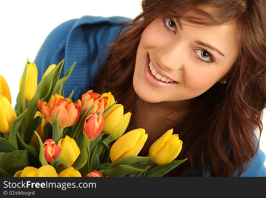 Young brunette woman with yellow and red flowers. Young brunette woman with yellow and red flowers