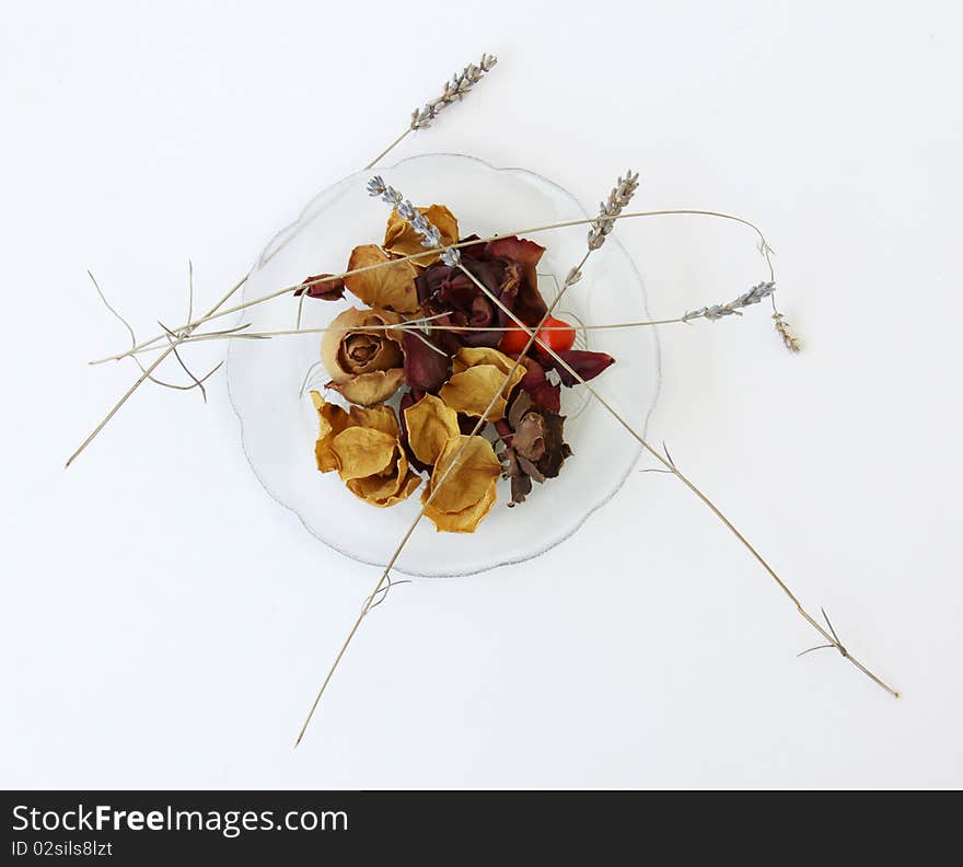 Dried Flowers in a transparent dish isolated on a white background