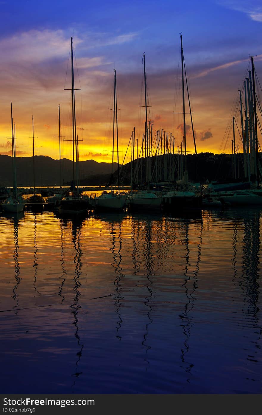 Many boat in a aharbour in the evening. Many boat in a aharbour in the evening