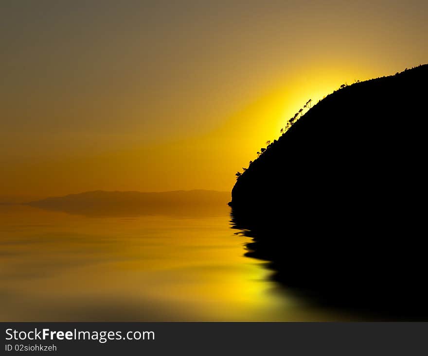 An orange and yellow sunset over a calm sea. An orange and yellow sunset over a calm sea