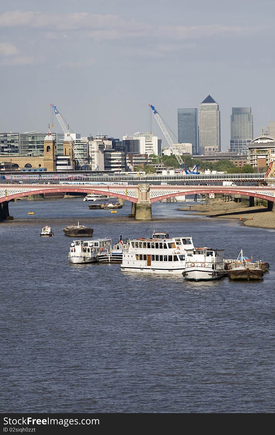 Boats crossing river and equipments in background