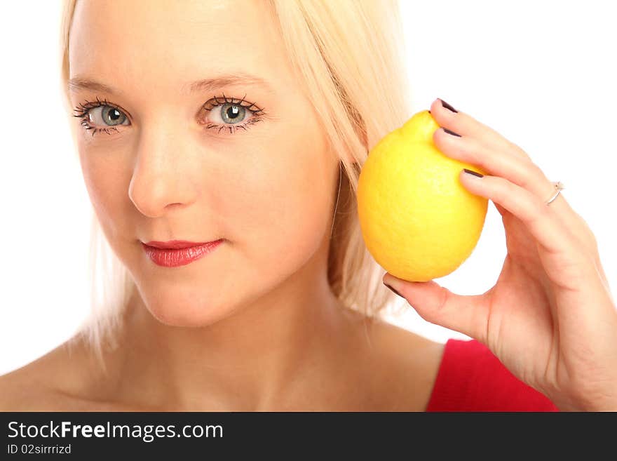 Young blond woman showing a citron. Young blond woman showing a citron