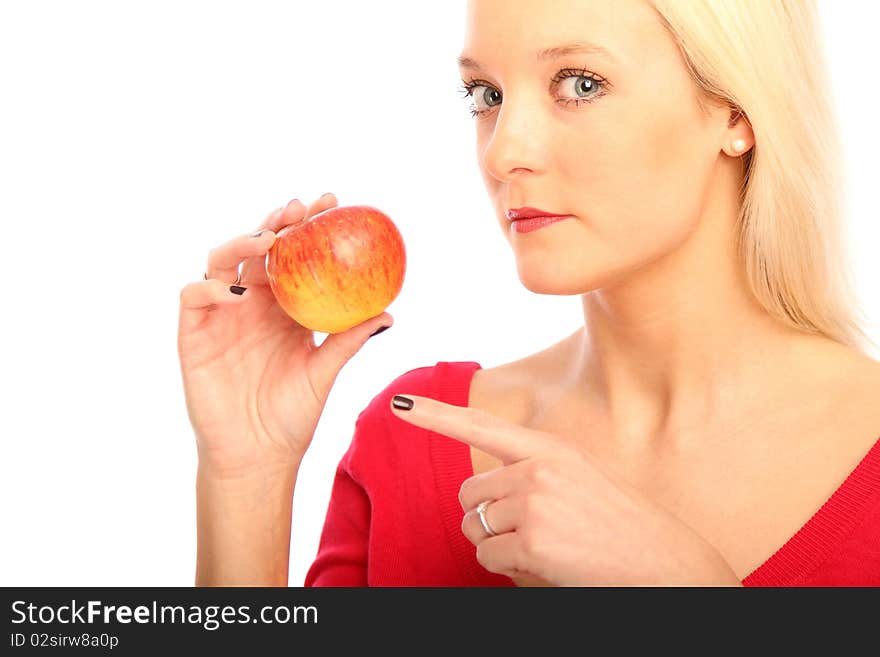 Young blond woman showing a apple. Young blond woman showing a apple