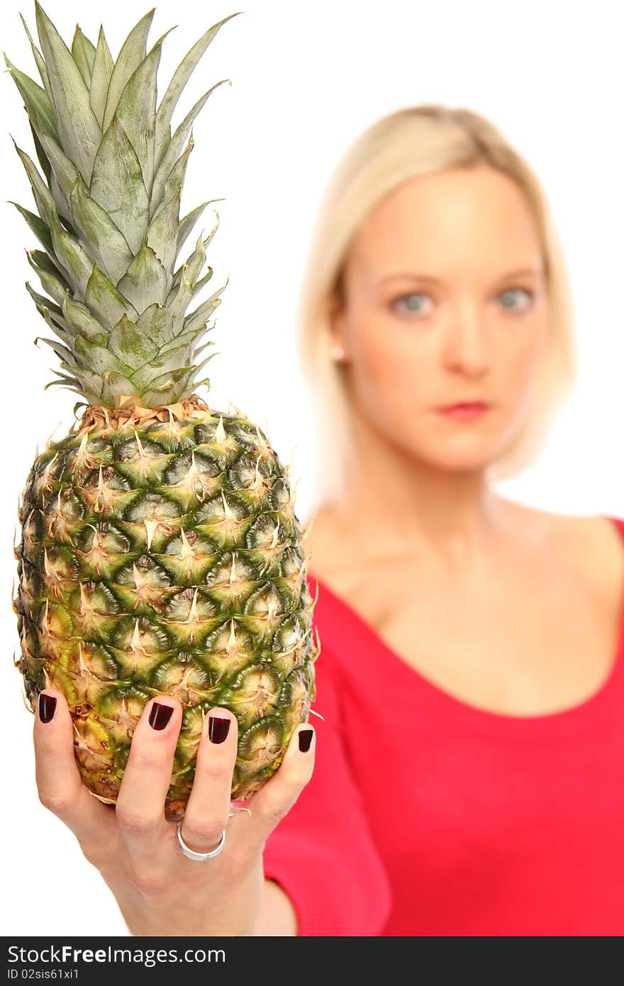 Young blond woman showing a Pineapple. Young blond woman showing a Pineapple