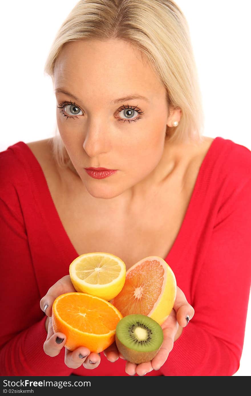 Blond woman holding fresh fruits