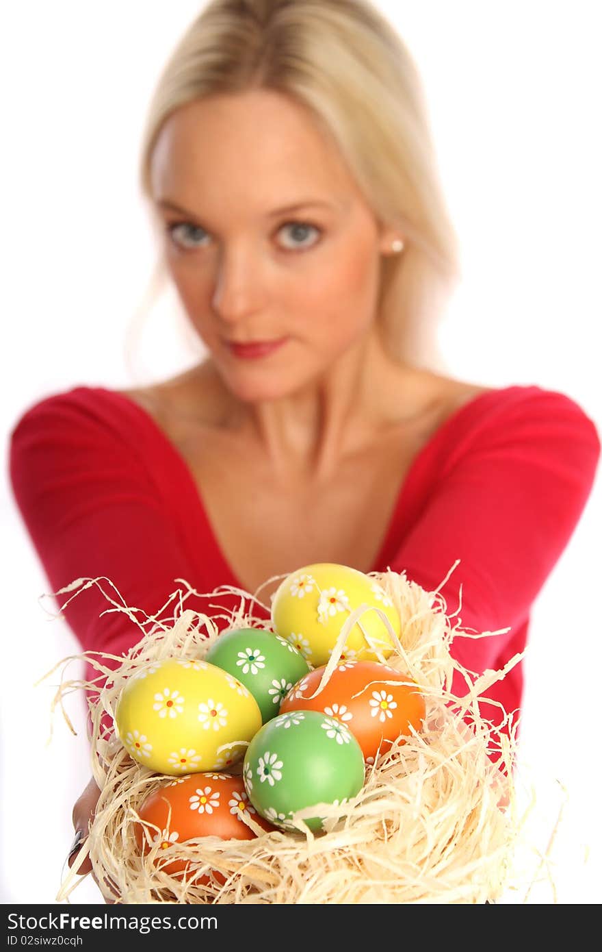 Beautiful blond woman holding some easter eggs. Beautiful blond woman holding some easter eggs