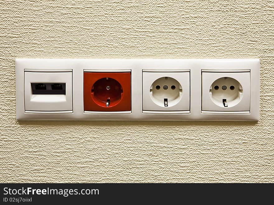 Electric and network sockets in a wall