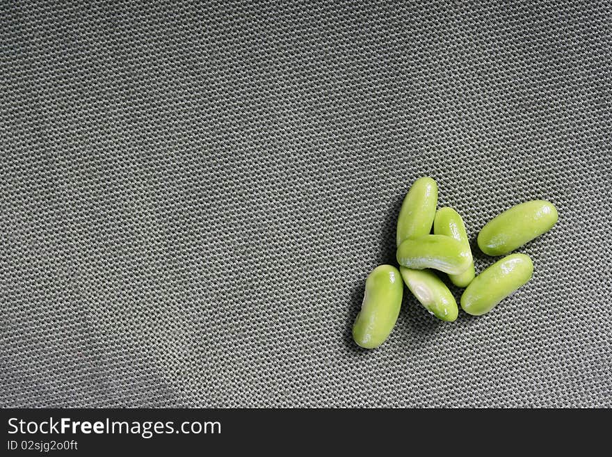 Green beans of the French string bean against from a fabric.