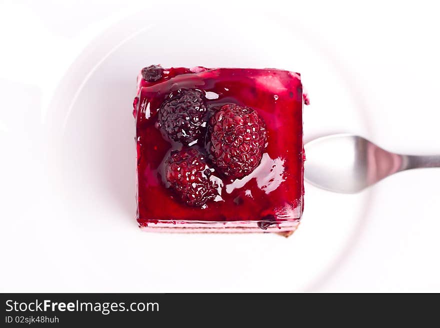 Blackberry cake on a white plate (shallow DOF)