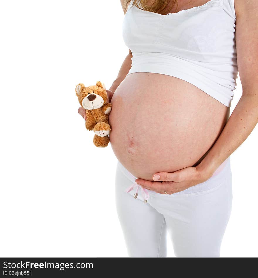 Young fresh pregnant woman with baby toys. Isolated over white background. Young fresh pregnant woman with baby toys. Isolated over white background.