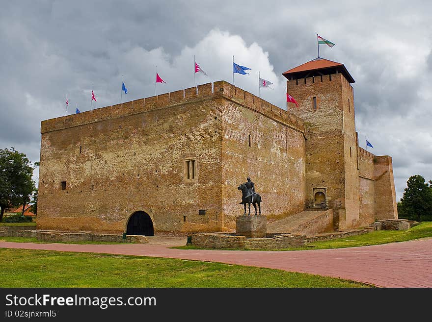 Ancient brick castle in europe under the stormy sky