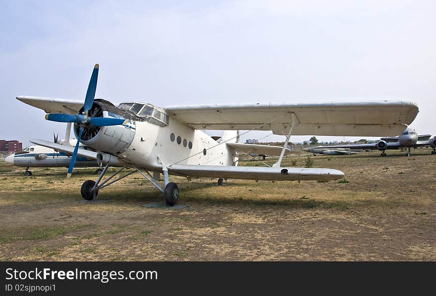 Light passenger plane aircraft. Biplane is on the ground.