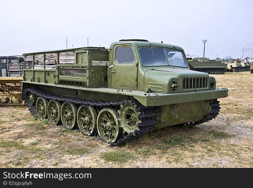 Old Army heavy all-terrain vehicle on tracks. Used to move goods and foot.