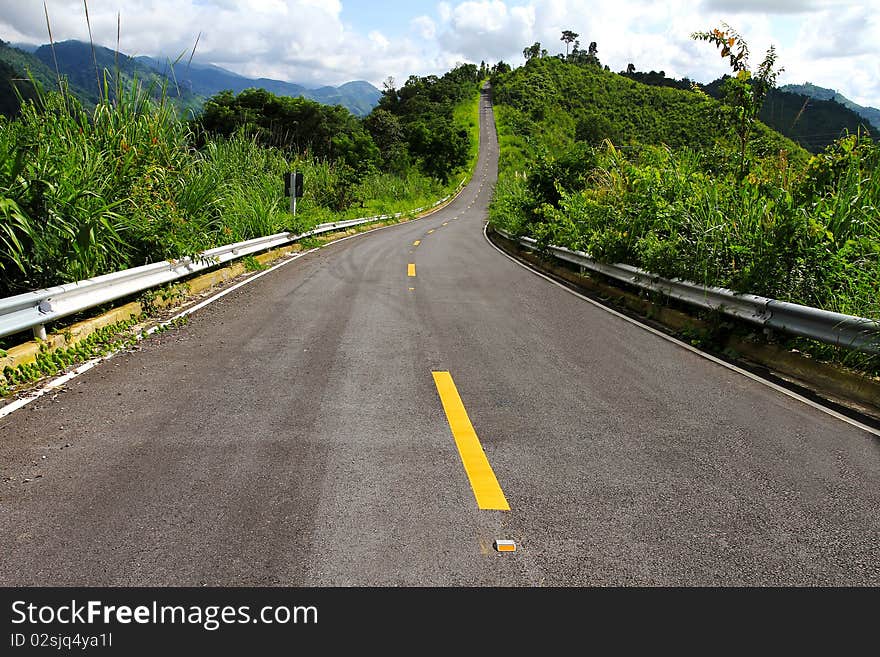 Asphalt roadway with yellow line