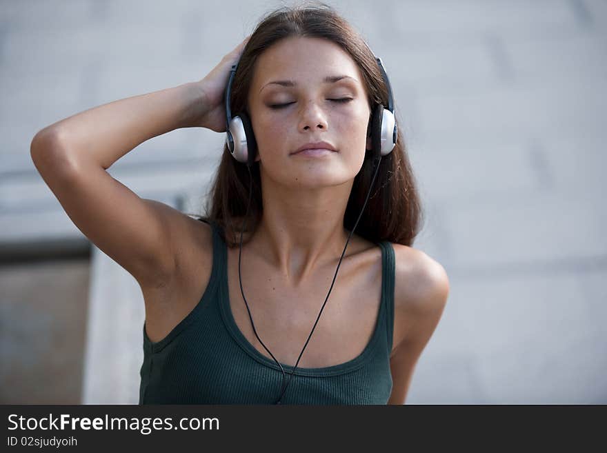 Beautiful teenage girl listening to muscic and relaxing. Beautiful teenage girl listening to muscic and relaxing