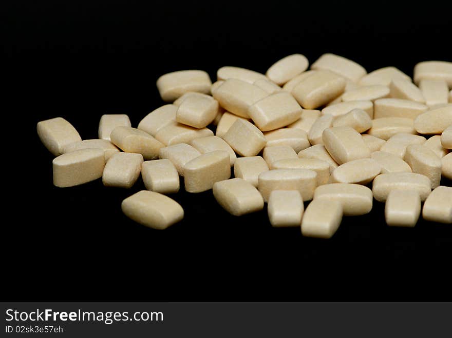 Pills on a black background